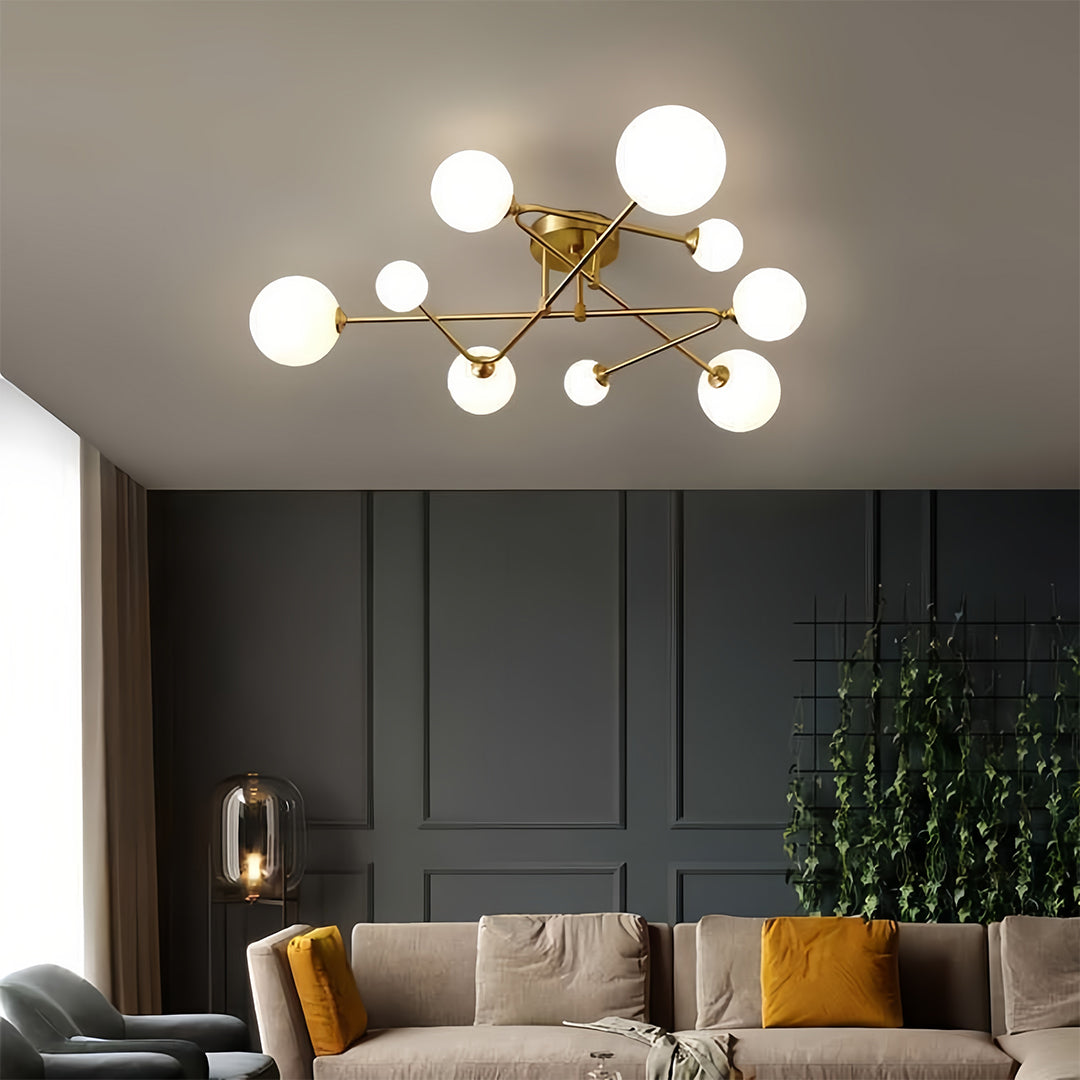Designer gold semi flush mount light with multiple arms providing distributed illumination in modern room