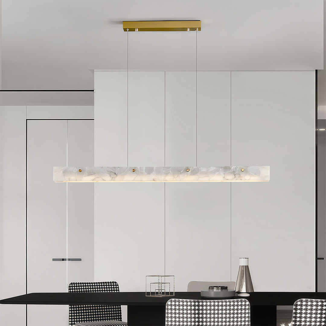 Detailed view of a copper metal pendant light, highlighting the gold accent and marble texture.