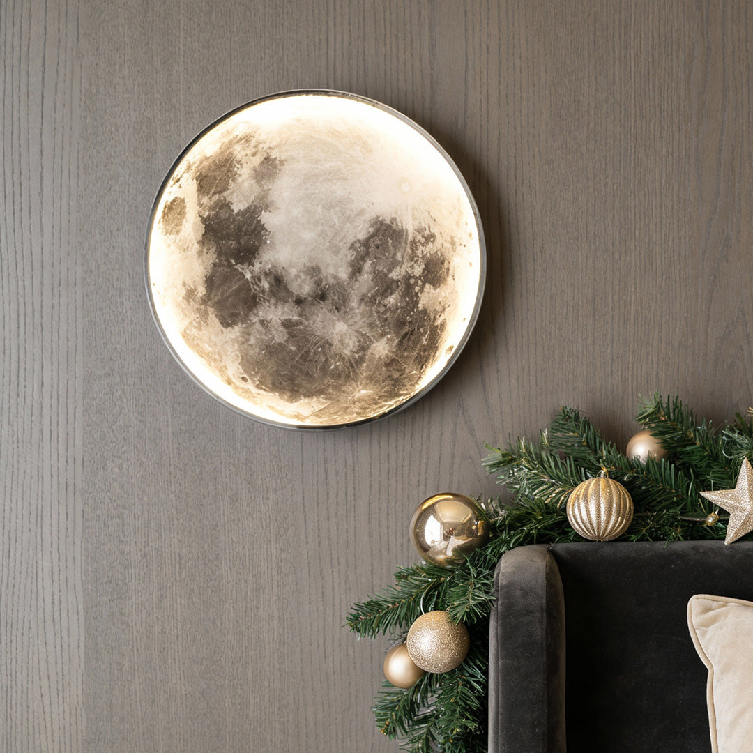 Full moon lamp wall decor with detailed moon surface, placed beside Christmas garland for cozy holiday atmosphere