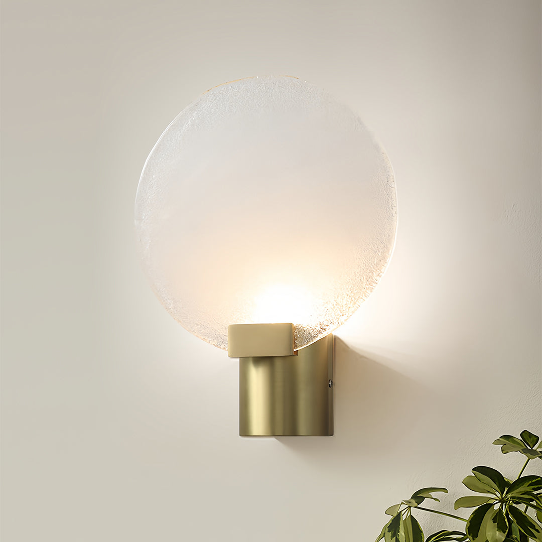 Detailed view of a round wall light showcasing the frosted glass texture and warm light diffusion.