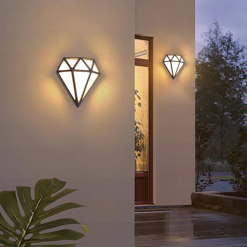 Diamond shape wall light providing ambient lighting near a wooden door.