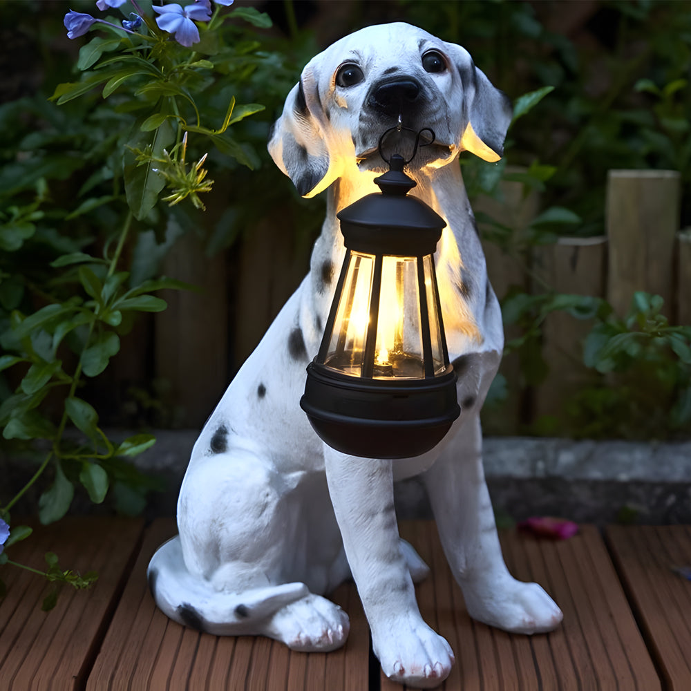 Dalmatian dog solar light statue holding a lantern outdoors