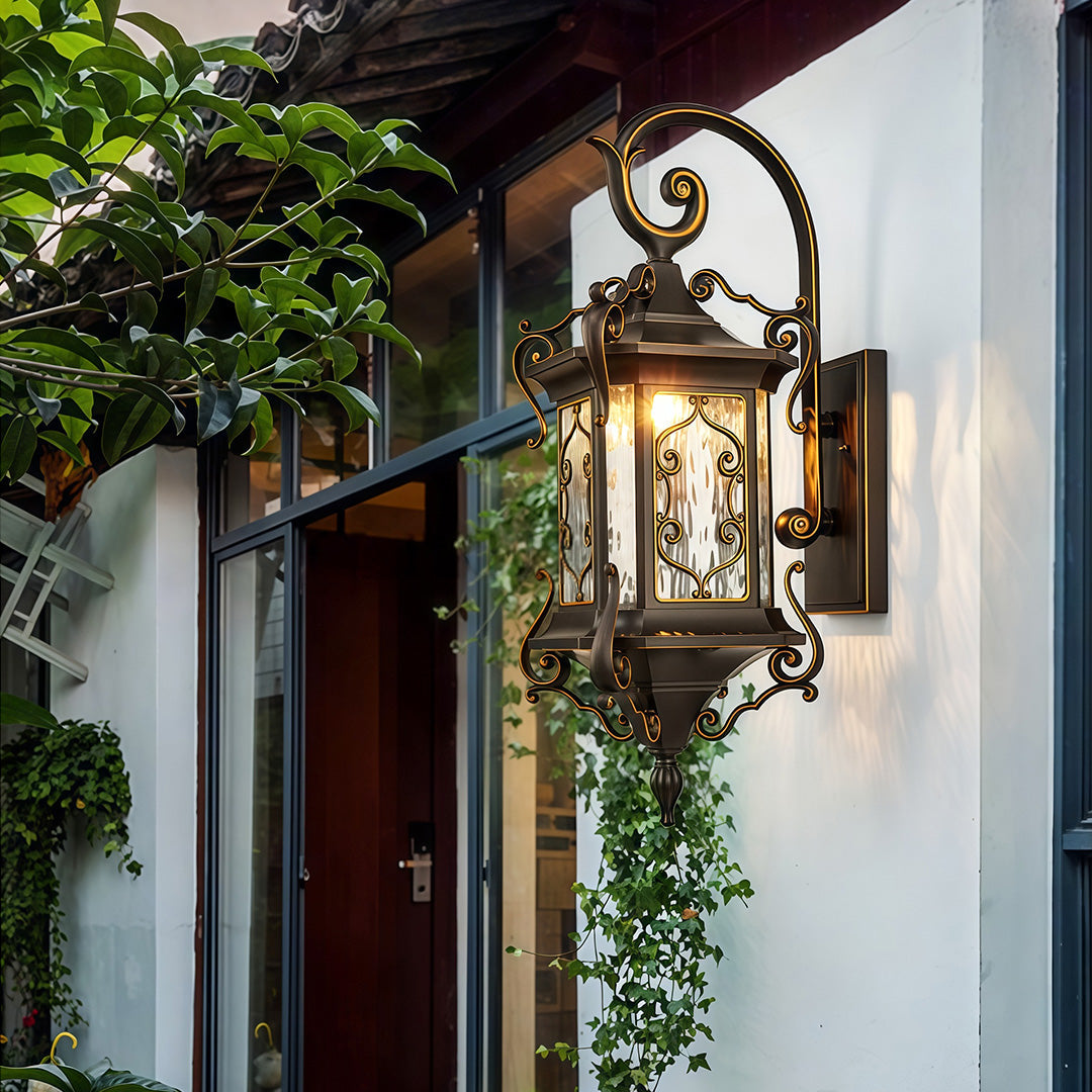 Outdoor wall sconce lights installed beside a wooden door, creating welcoming ambiance.