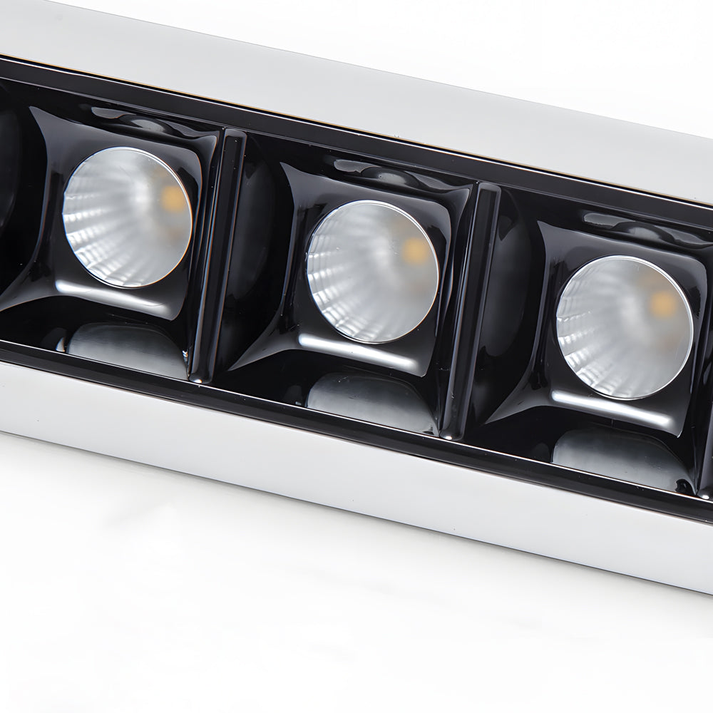 Double-head recessed ceiling spot light fixture for adjustable illumination.