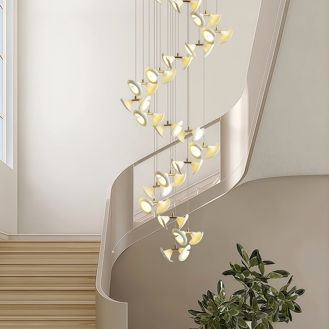 Tall modern brass ceramic chandeliers with spiral design for double-height spaces.