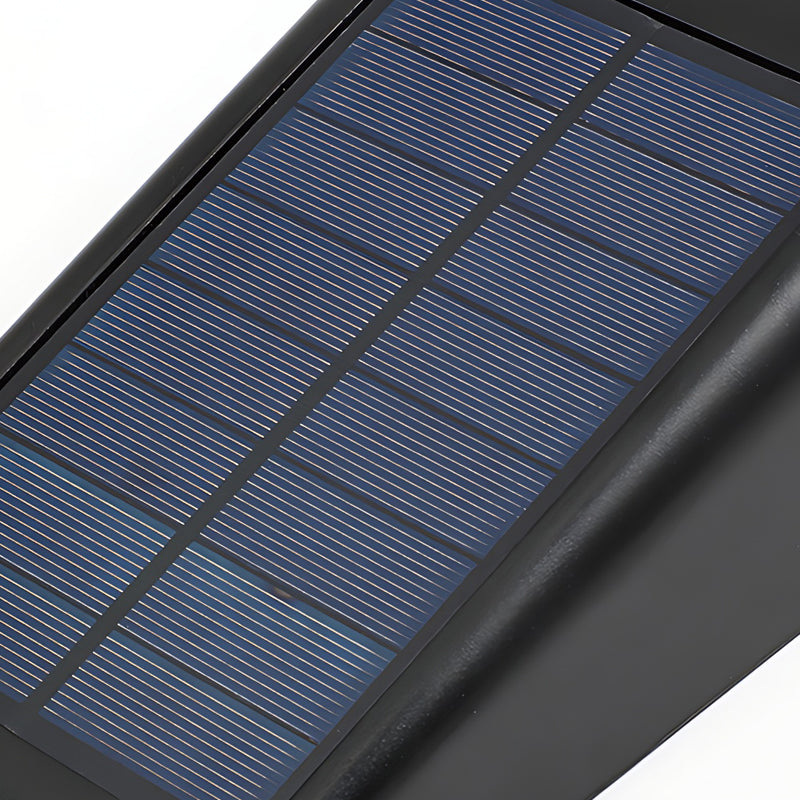 Down light wall sconce featuring an integrated solar panel.