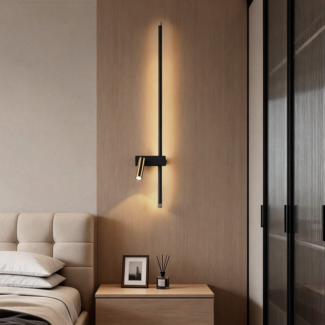 Bedroom interior featuring a sleek dual light wall sconce mounted beside the bed.