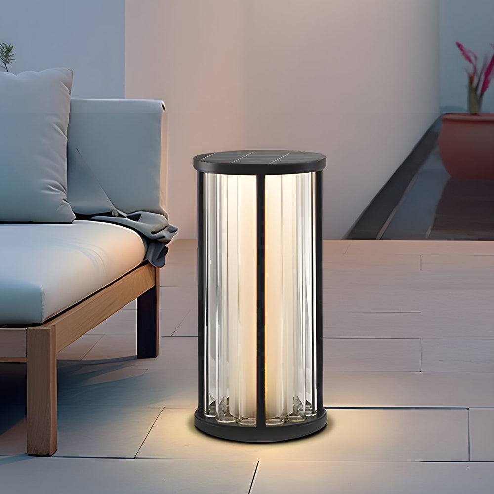 Contemporary lounge area featuring sleek cylindrical table lamp with modern geometric design elements