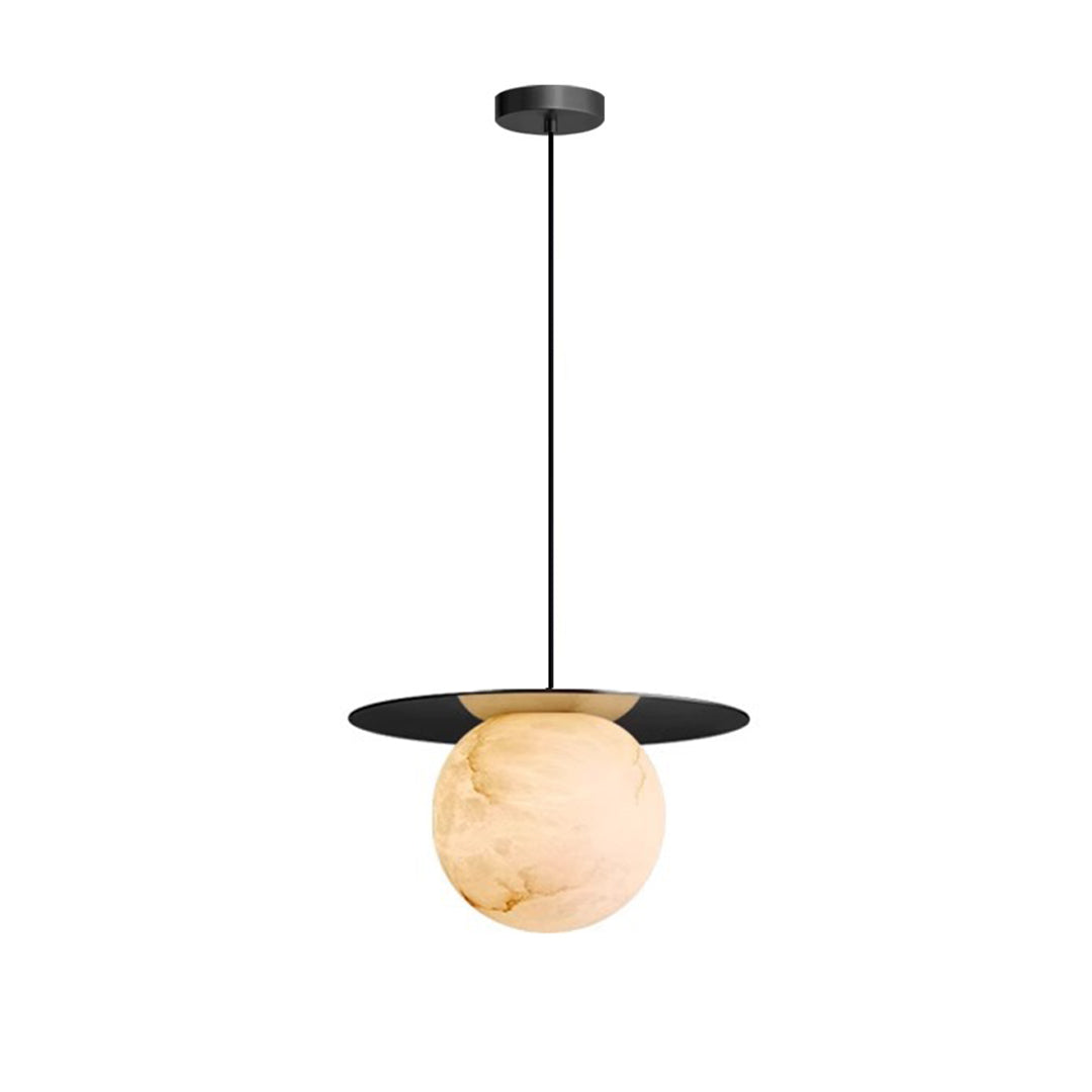 Elegant ball pendant light with a white marble sphere, hanging above a cozy living room sofa.