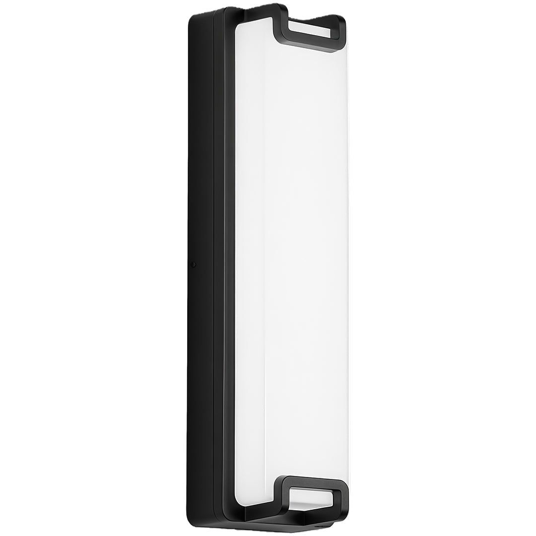 Elegant black outdoor wall sconce providing subtle illumination on an exterior wall, ideal for modern spaces.