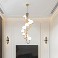 Elegant black spiral globe chandelier with cascading frosted globes hanging gracefully.