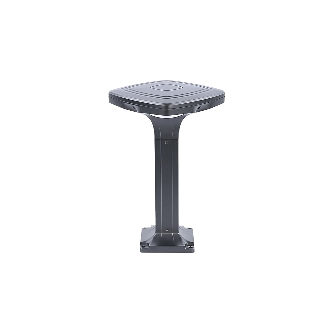 Elegant black outdoor wall light illuminating a stone pathway at dusk.