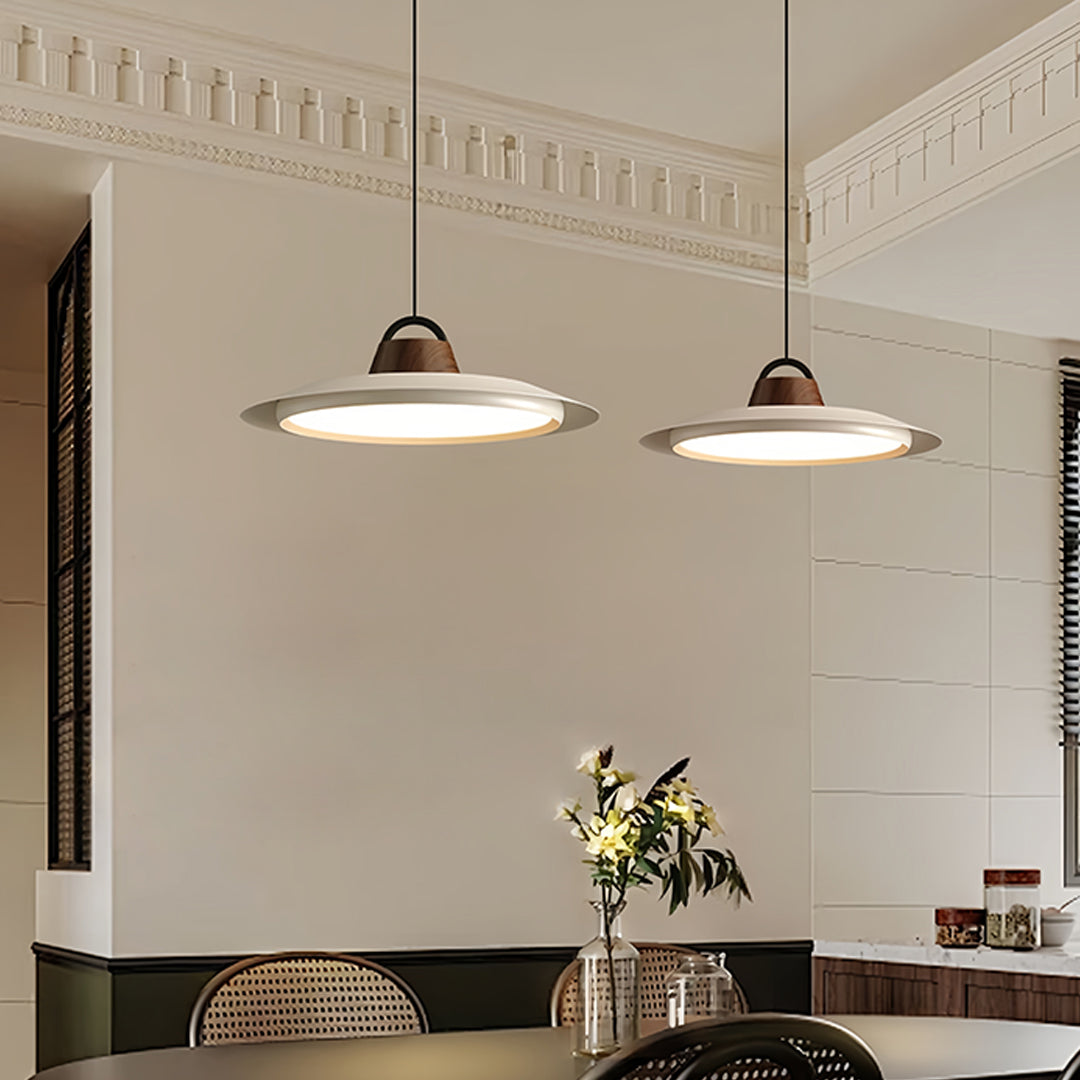 Elegant single pendant lights for kitchen featuring dual installation over kitchen island workspace