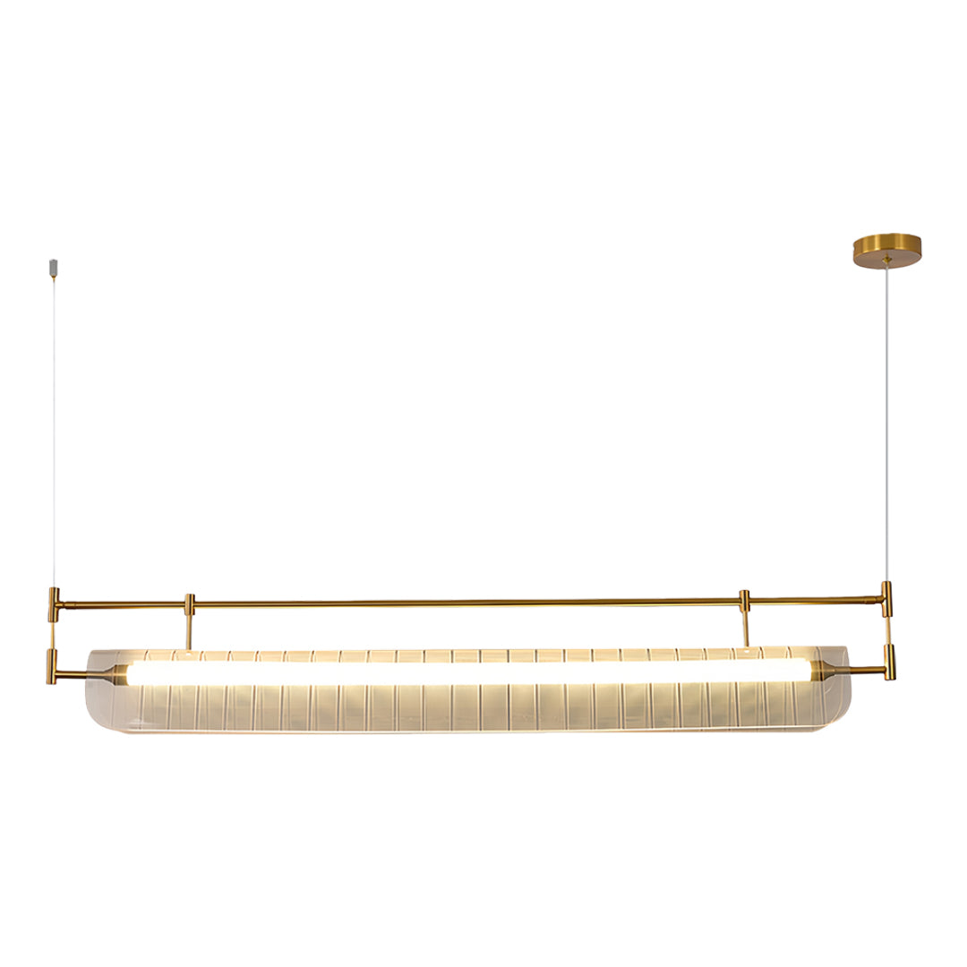 Elegant linear light pendant with textured crystal-like shade in gold and beige tones on white.