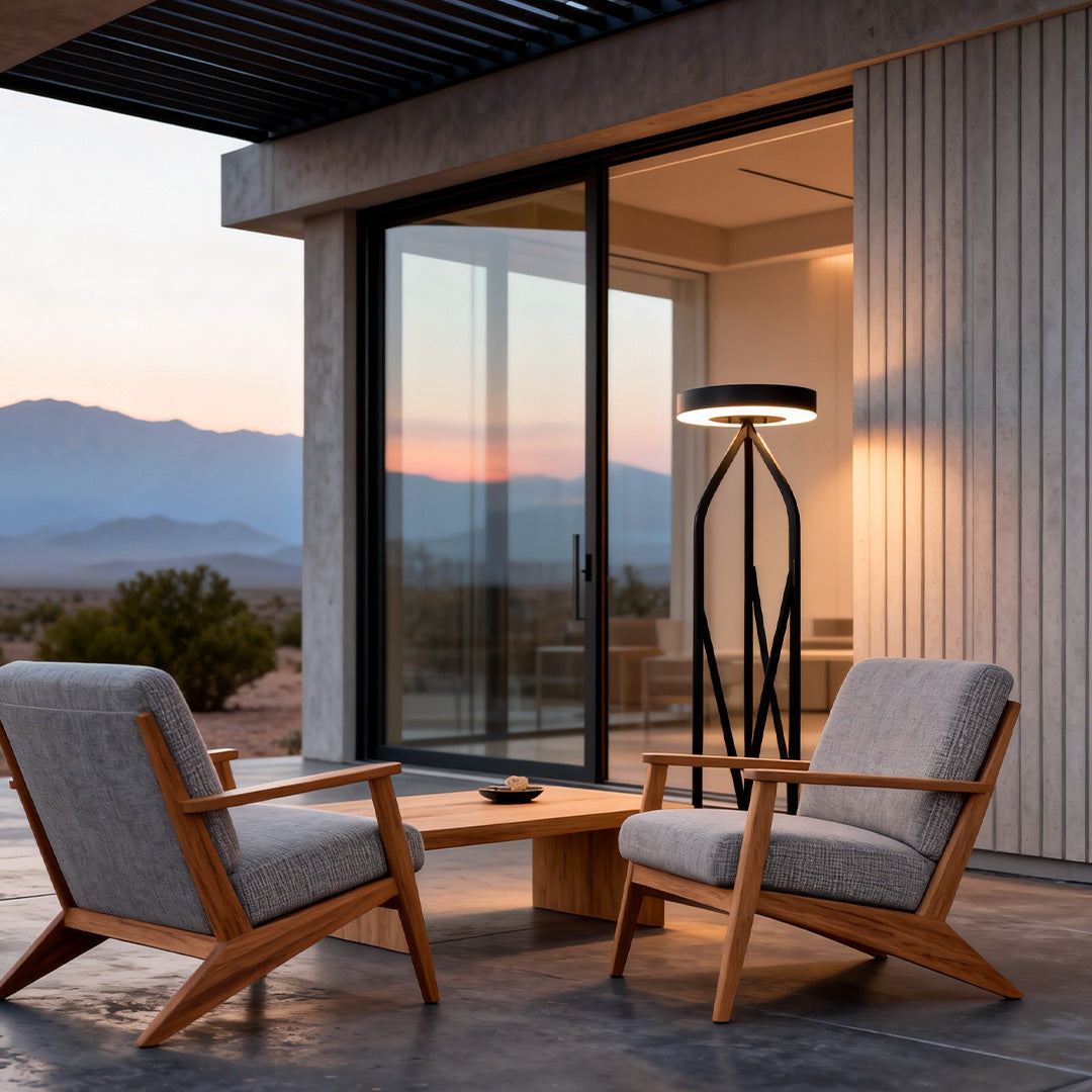 Elegant outdoor patio floor lamps providing soft lighting for a relaxed seating area with wooden chairs.