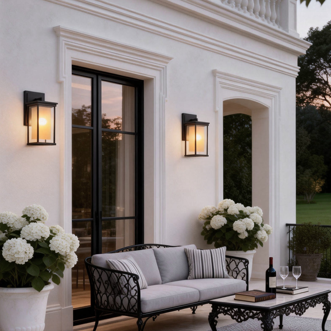 Elegant outdoor wall mounted light fixture above a patio sofa, creating a warm ambiance for outdoor seating areas.