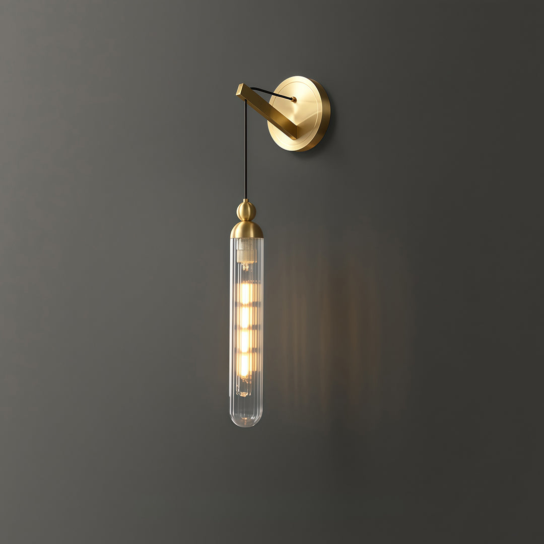 Elegant wall mount pendant light featuring glass shade chandelier styling creating warm accent glow on gray accent wall.