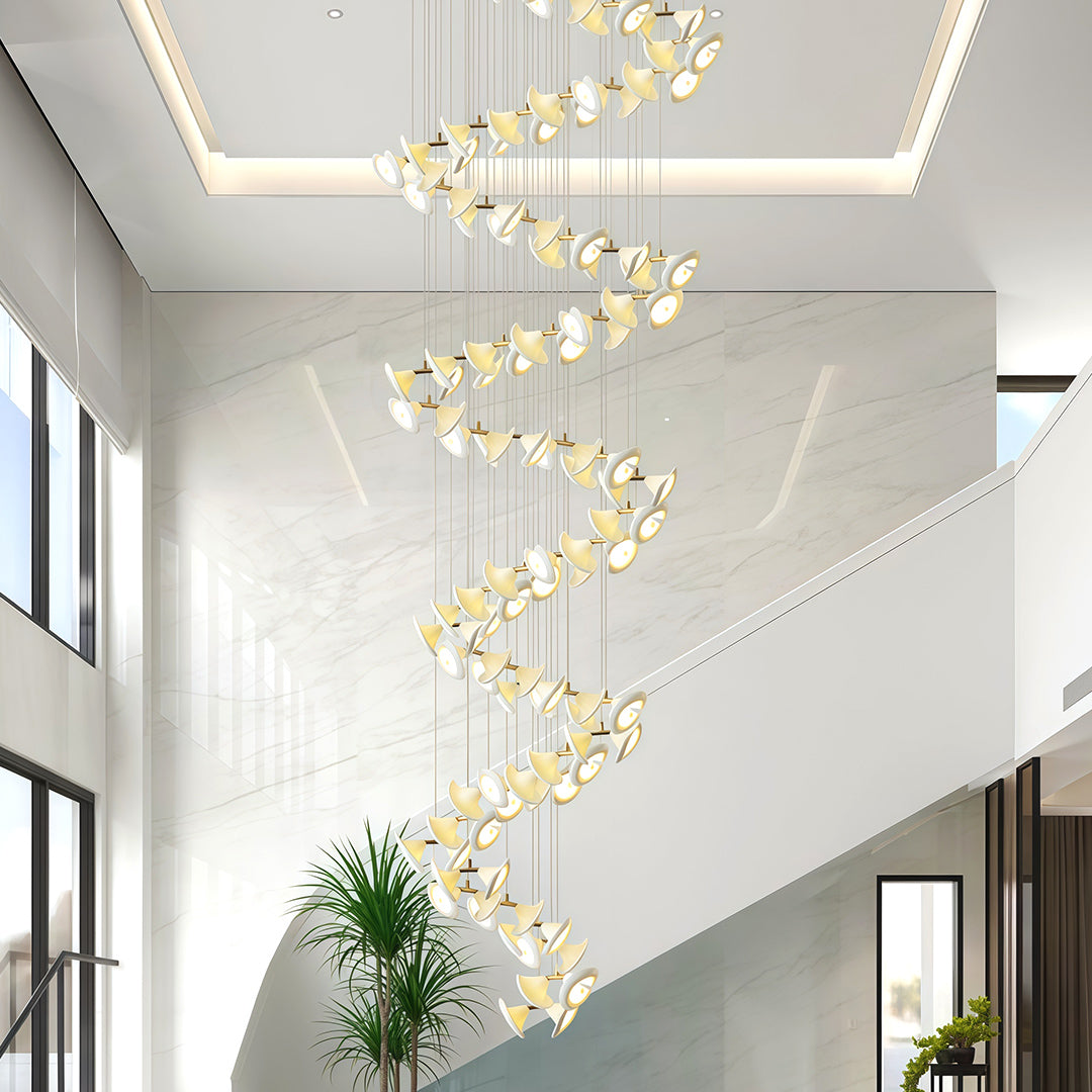 Brass spiral ceramic chandeliers illuminating a contemporary entryway.