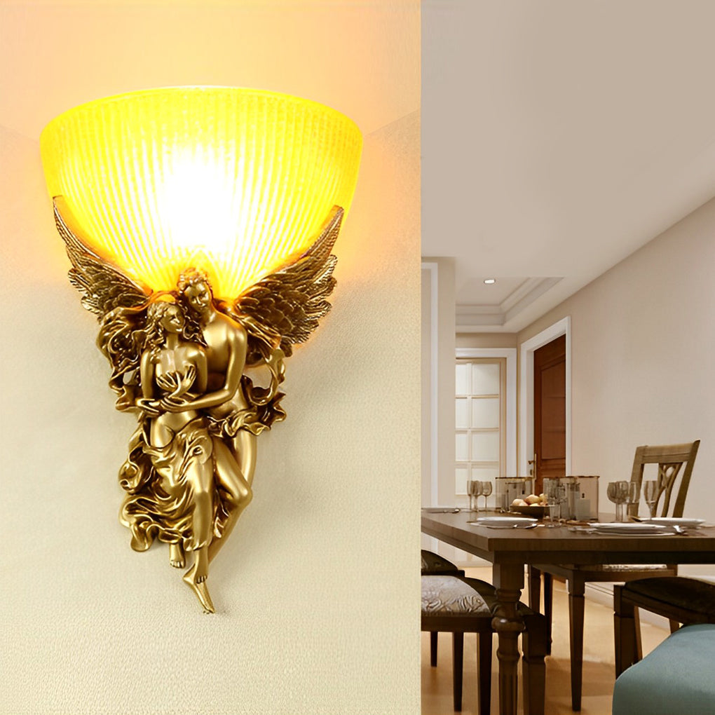 Close-up of a European angel wall sconce showcasing intricate angel sculpture and warm light.