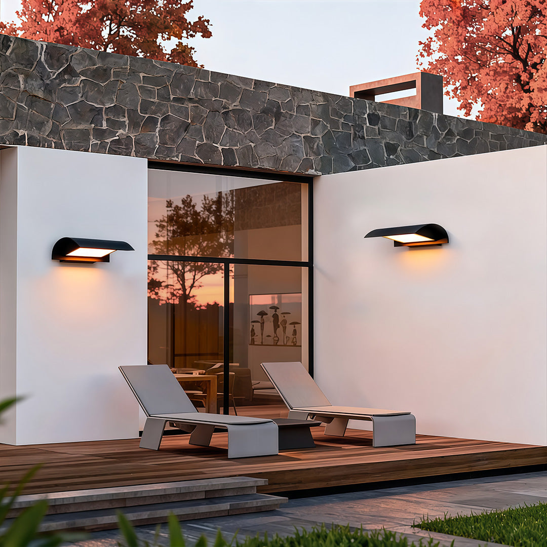 Modern exterior down wall lights installed on outdoor wall providing soft downward illumination.