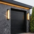 Exterior wall lights black with alabaster stone shade create a warm ambient glow while adding elegant texture to modern facades.
