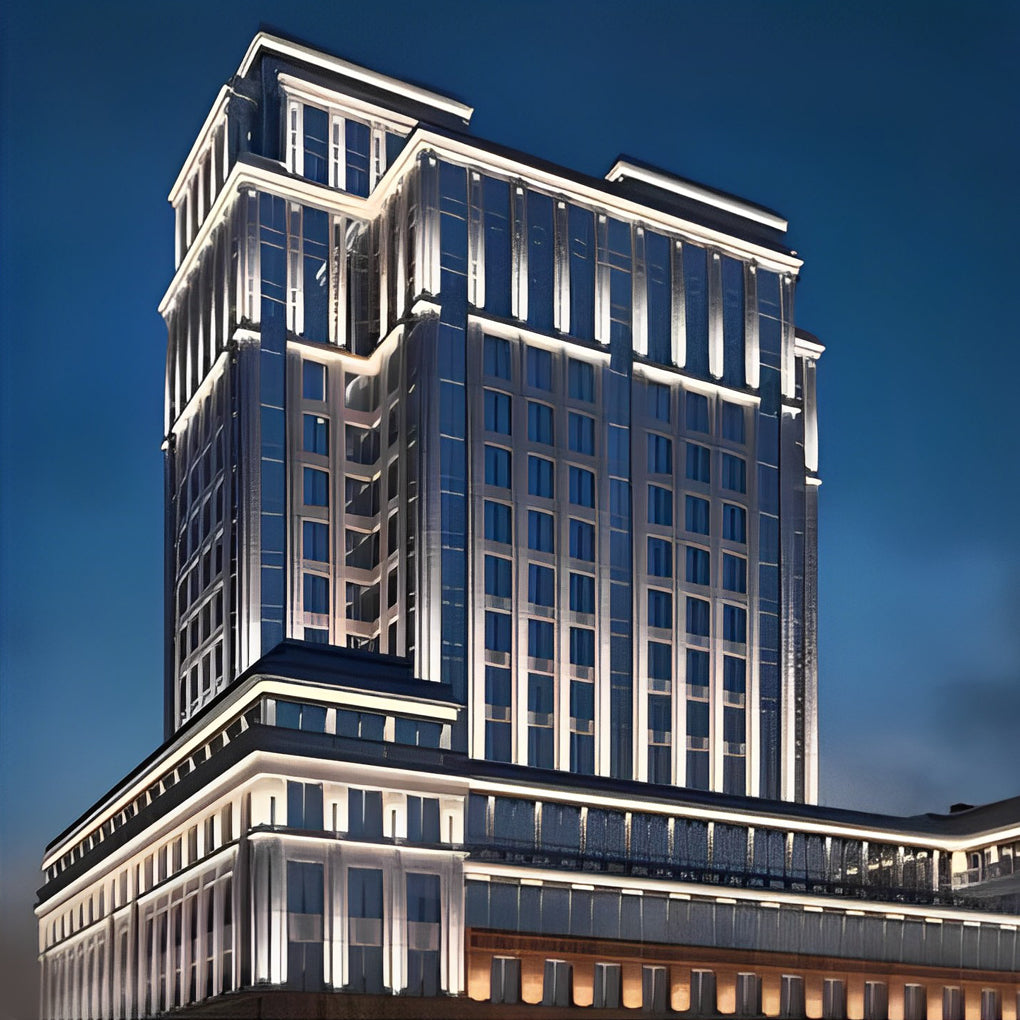 Facade spot lights accenting a high-rise building exterior, emphasizing vertical structure and architectural rhythm.