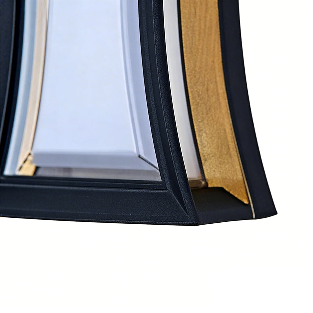 Fan shaped wall sconce with a rectangular variant, providing soft light near a doorway.