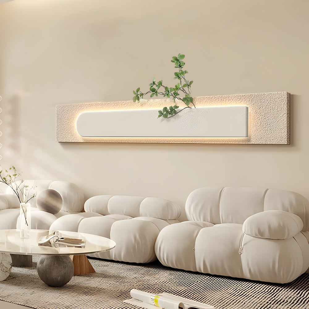 Faux sandstone wall light enhancing a contemporary living area with natural texture.