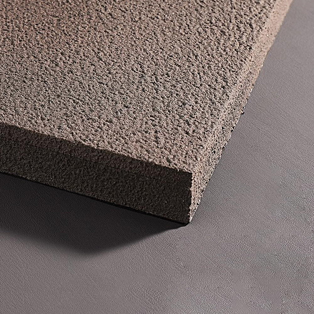 Faux sandstone wall light in gray, front view of the textured finish.