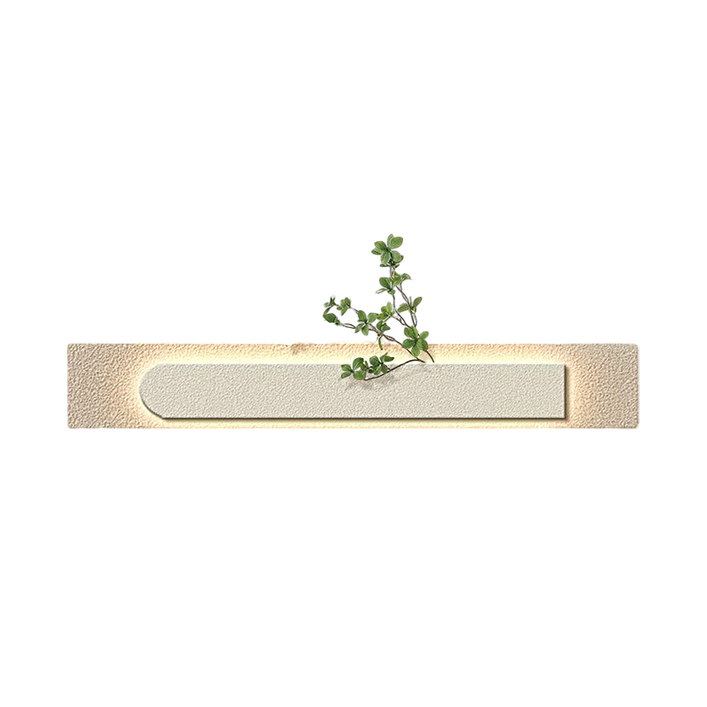 Faux sandstone wall light in green, front view of the ambient lighting.