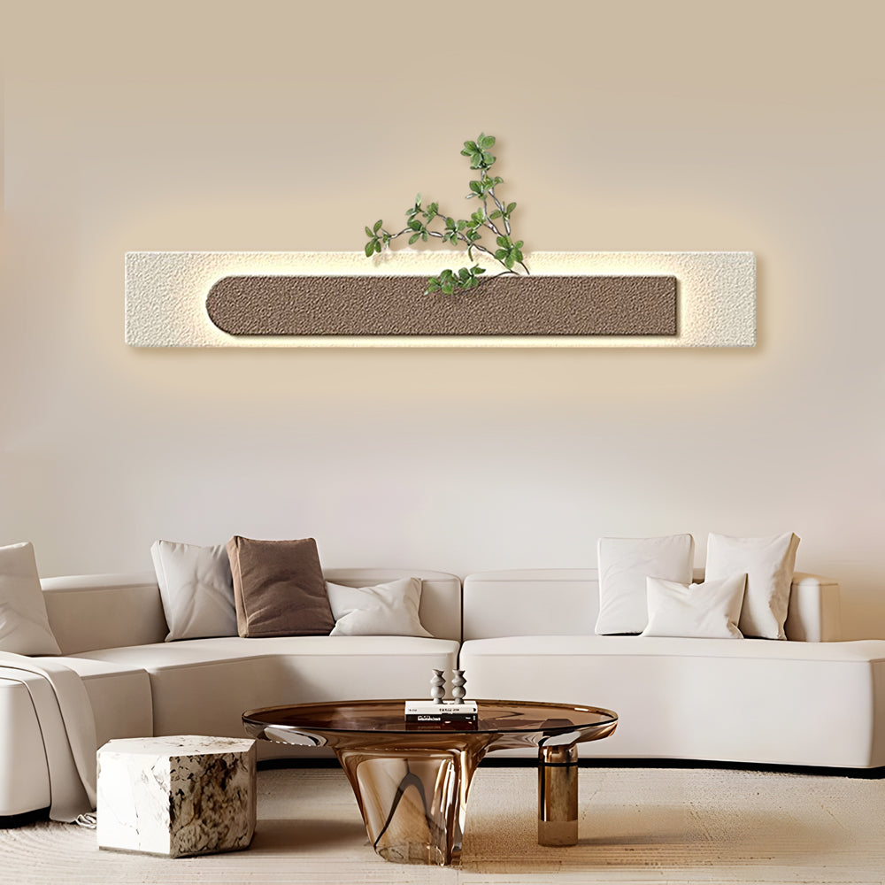 Faux sandstone wall light providing warm light above a modern coffee table.