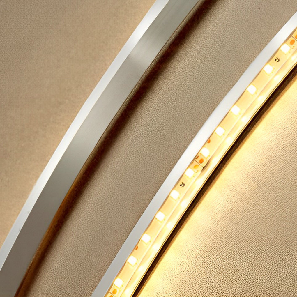Feather LED wall lamp with a modern design, enhancing a stylish dining room.