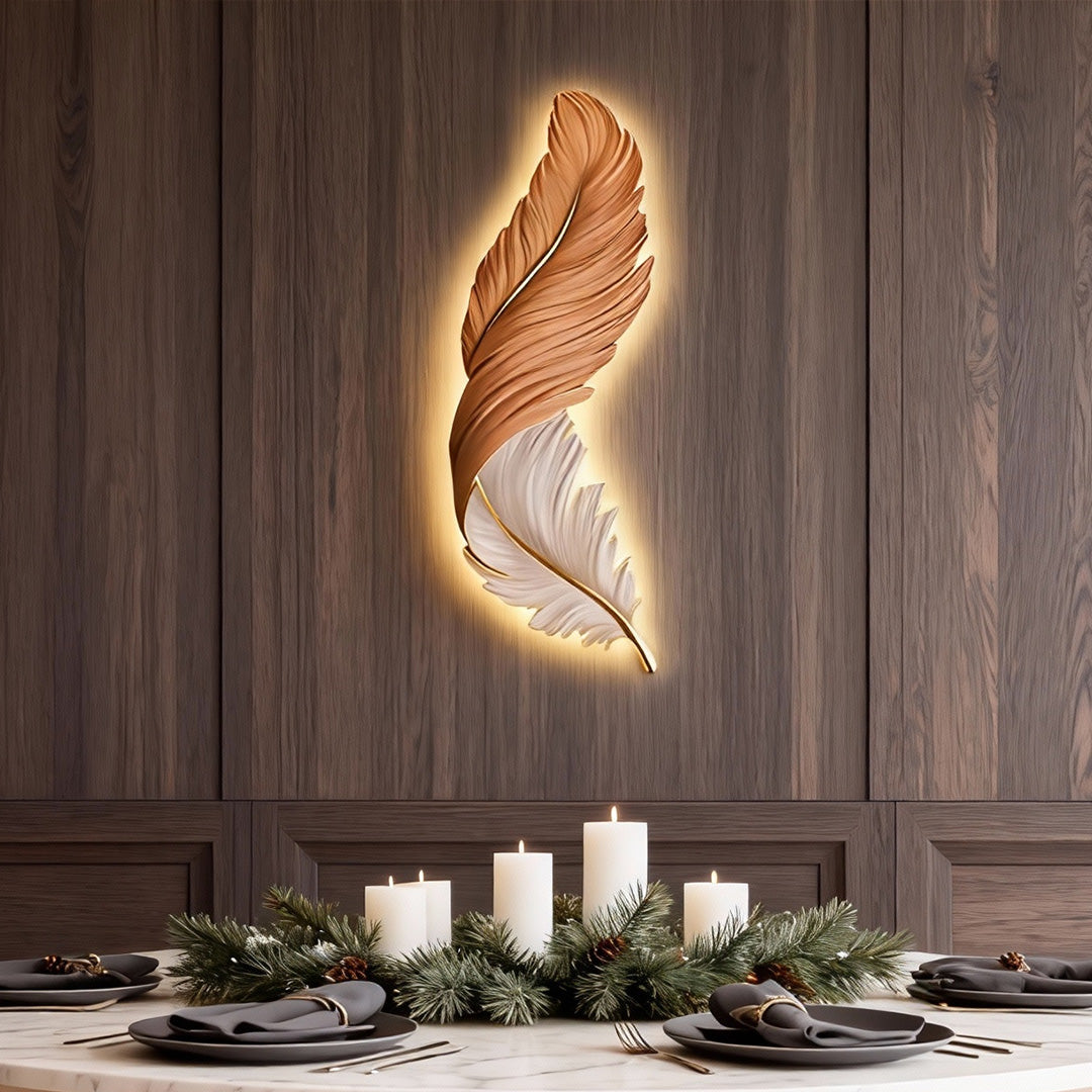 Elegant feather wall lamp used as accent lighting above a dining table.
