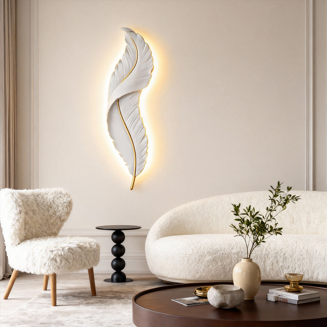 Minimalist feather wall light installed on beige wall in contemporary seating area.