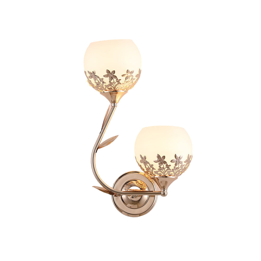 Floral wall sconce with silver finish and dual frosted glass shades isolated on white.