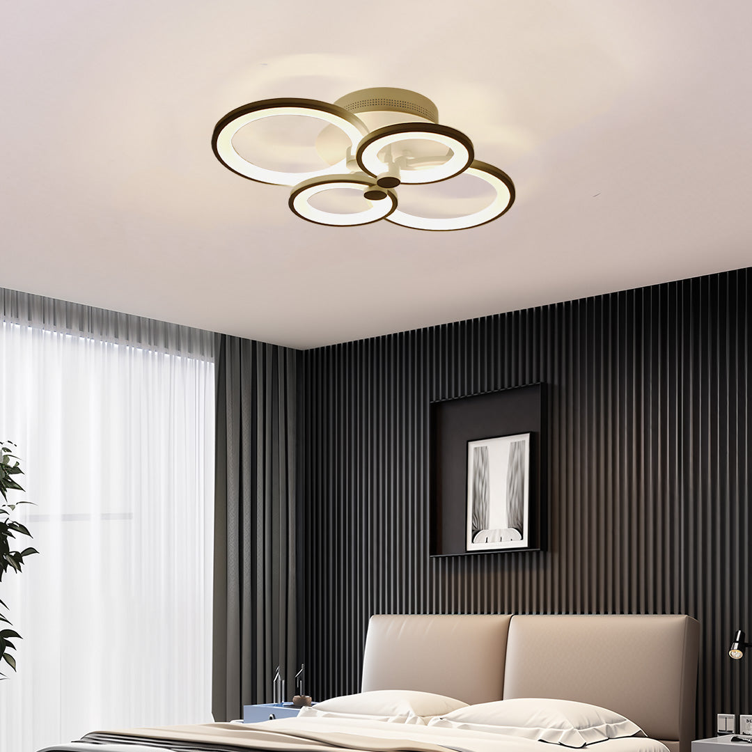Elegant bedroom setup using flush mount multi ring ceiling lights with layered ring design.