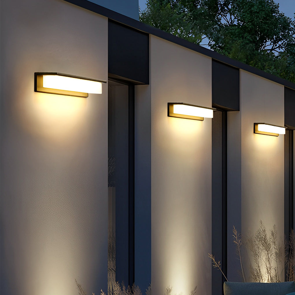 Front porch light fixtures mounted on modern house facade.