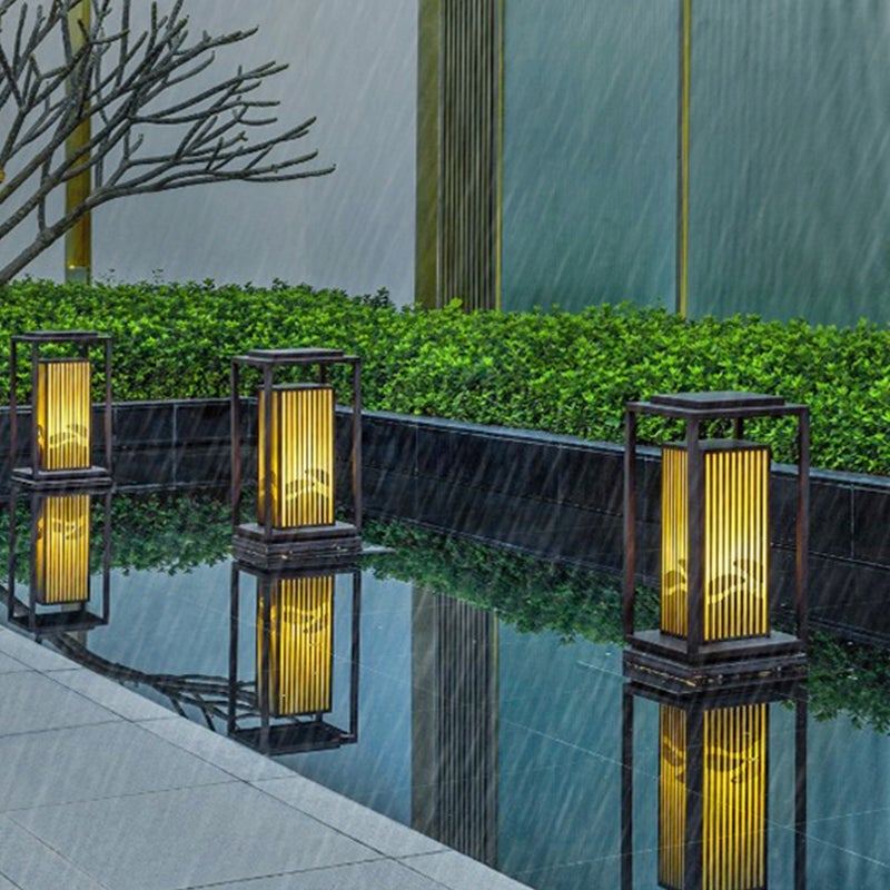 Garden bollards lights with a sleek design, illuminating a contemporary outdoor space.