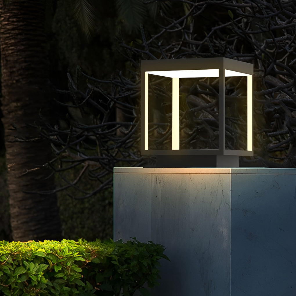 Concrete pillar light illuminating a garden landscape at night