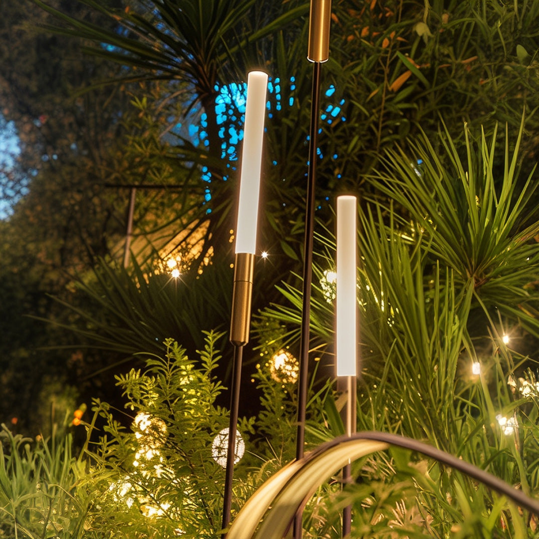 Garden landscape spike light installation among tropical plants creating beautiful ambient lighting for outdoor entertainment
