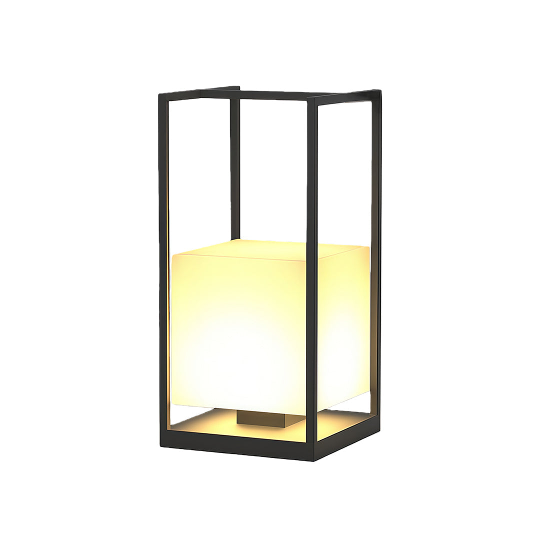 Contemporary outdoor lanterns installed along a garden pathway, enhancing the landscape with soft lighting.