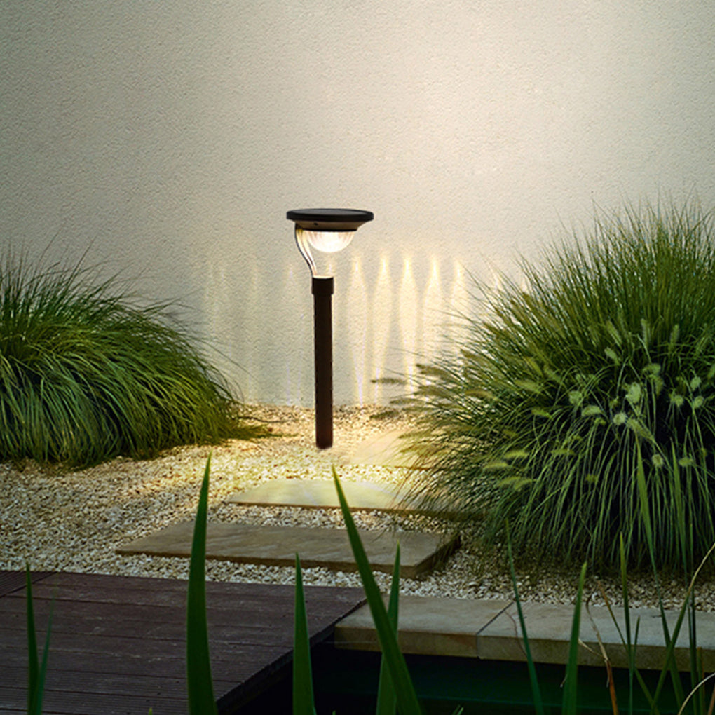 Garden stake solar lights enhancing a backyard with soft, warm glow.
