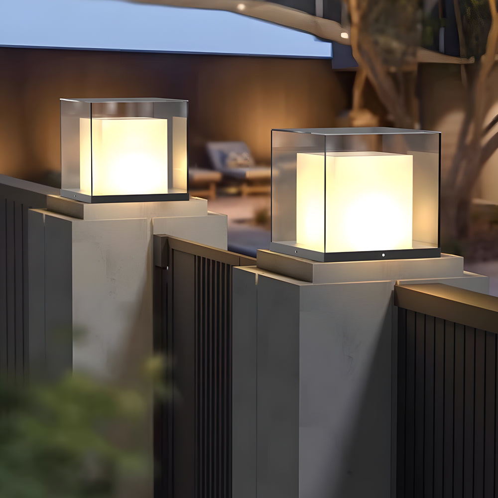 Gate pillar light with a contemporary cube design, enhancing the entrance of a modern backyard.