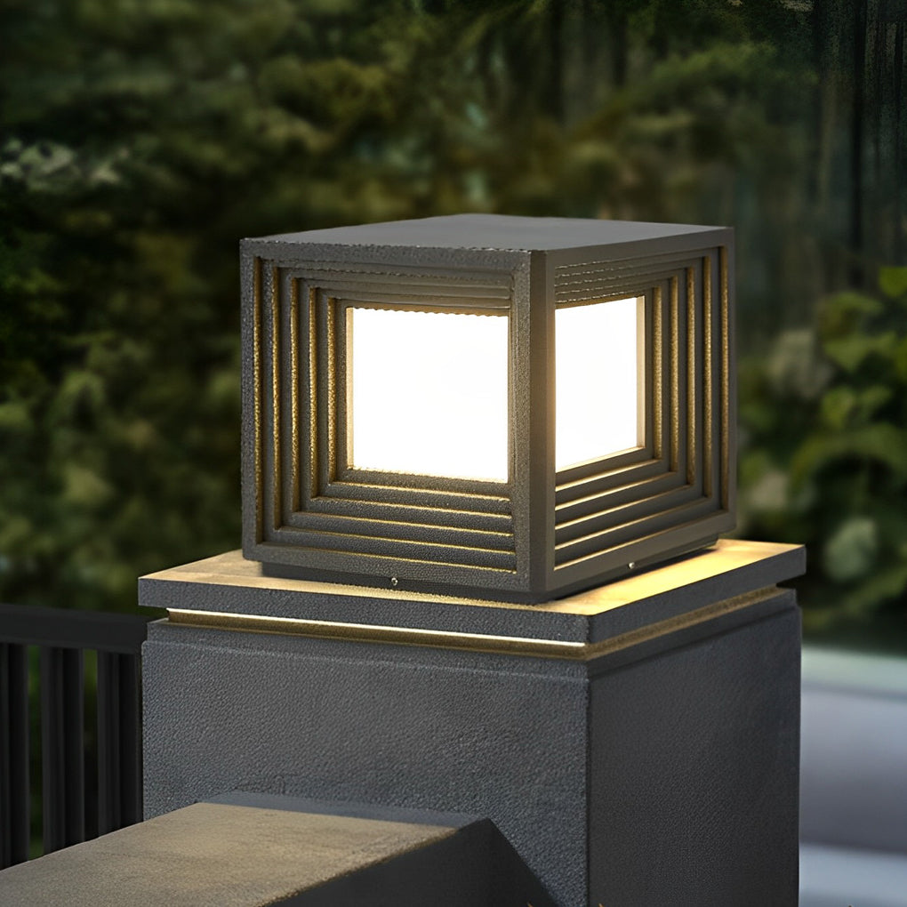 Minimalist gate pillar lights providing soft illumination for a residential gate.