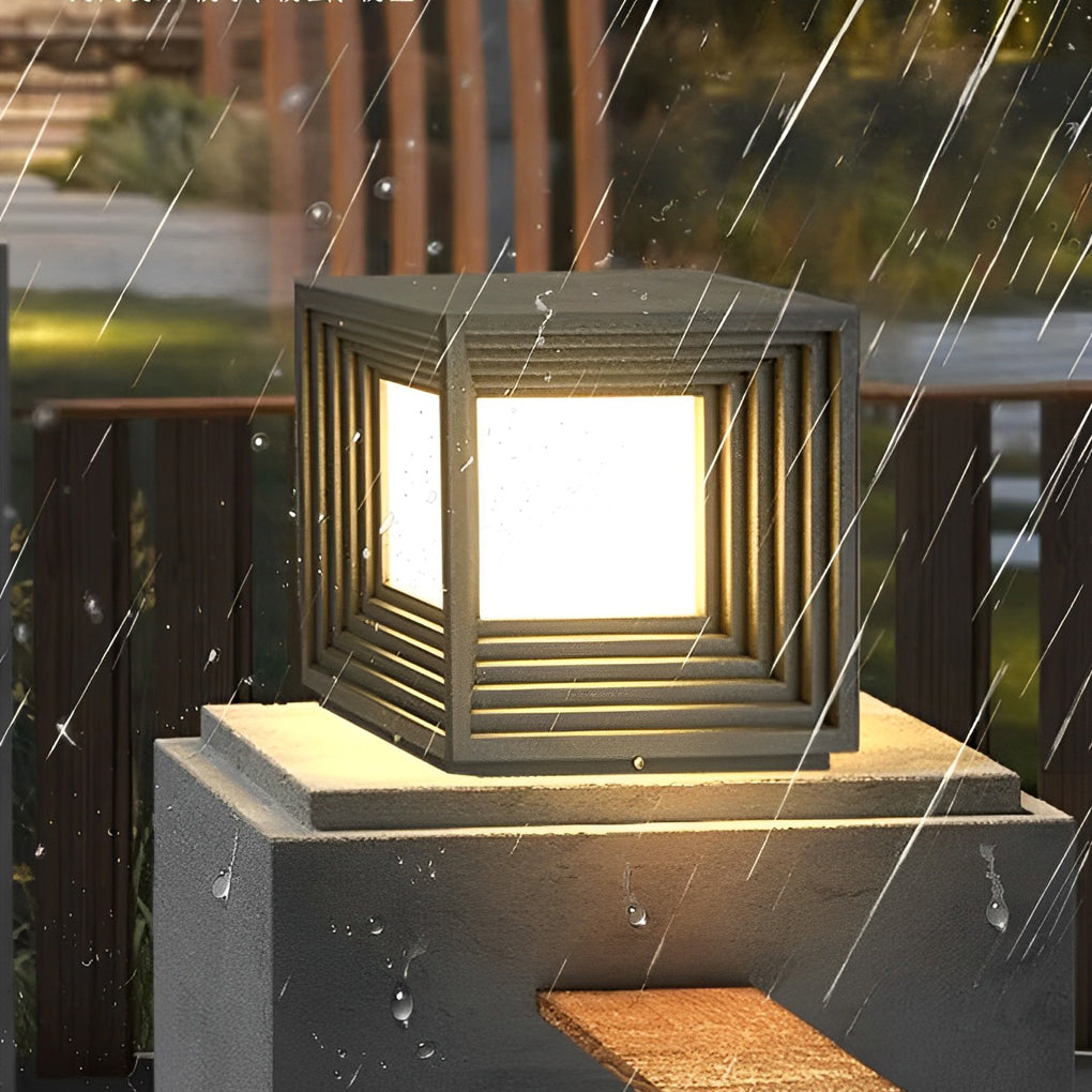 Gate pillar lights casting a warm glow on a wooden fence and pathway.