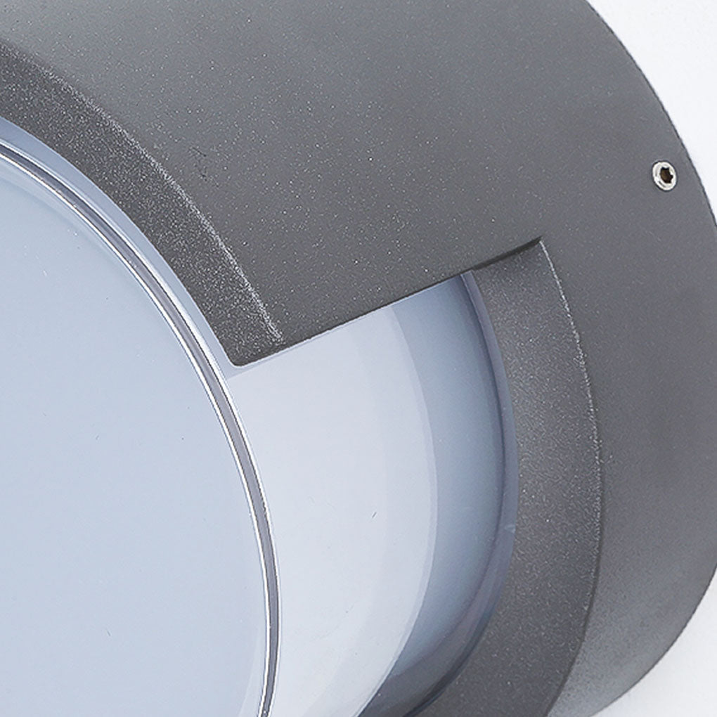 Geometric outdoor sconce providing ambient light in a modern outdoor space.