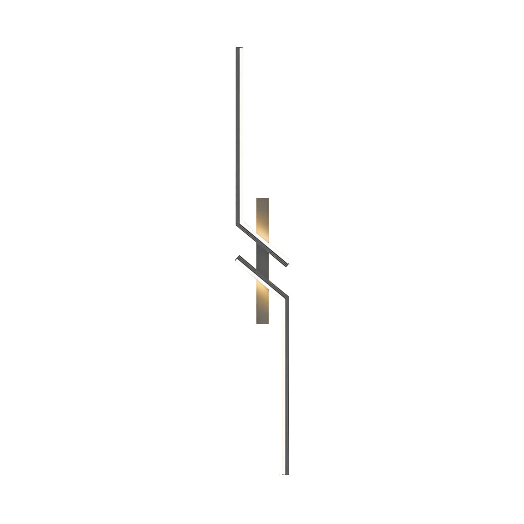 Geometric wall sconce with a black finish, installed in a modern bedroom setting.