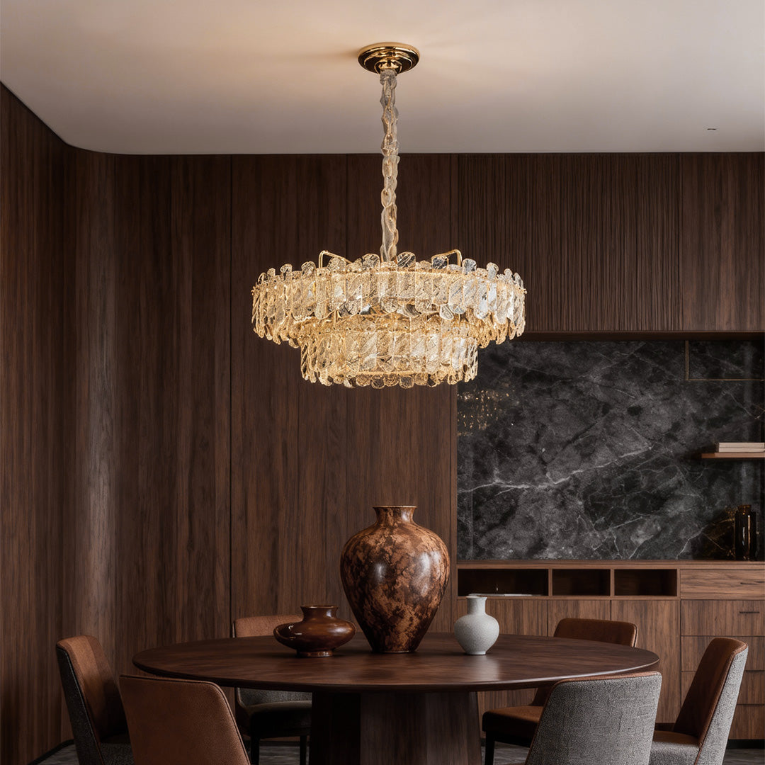 Glamorous Nordic chandelier with glass shade chandelier styling illuminating elegant dining room with rich wood tones and upholstered chairs.