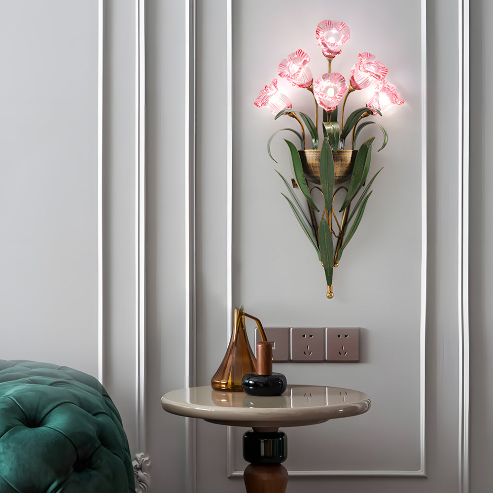 Glass flower sconce with white flowers, providing elegant lighting in a modern living room.