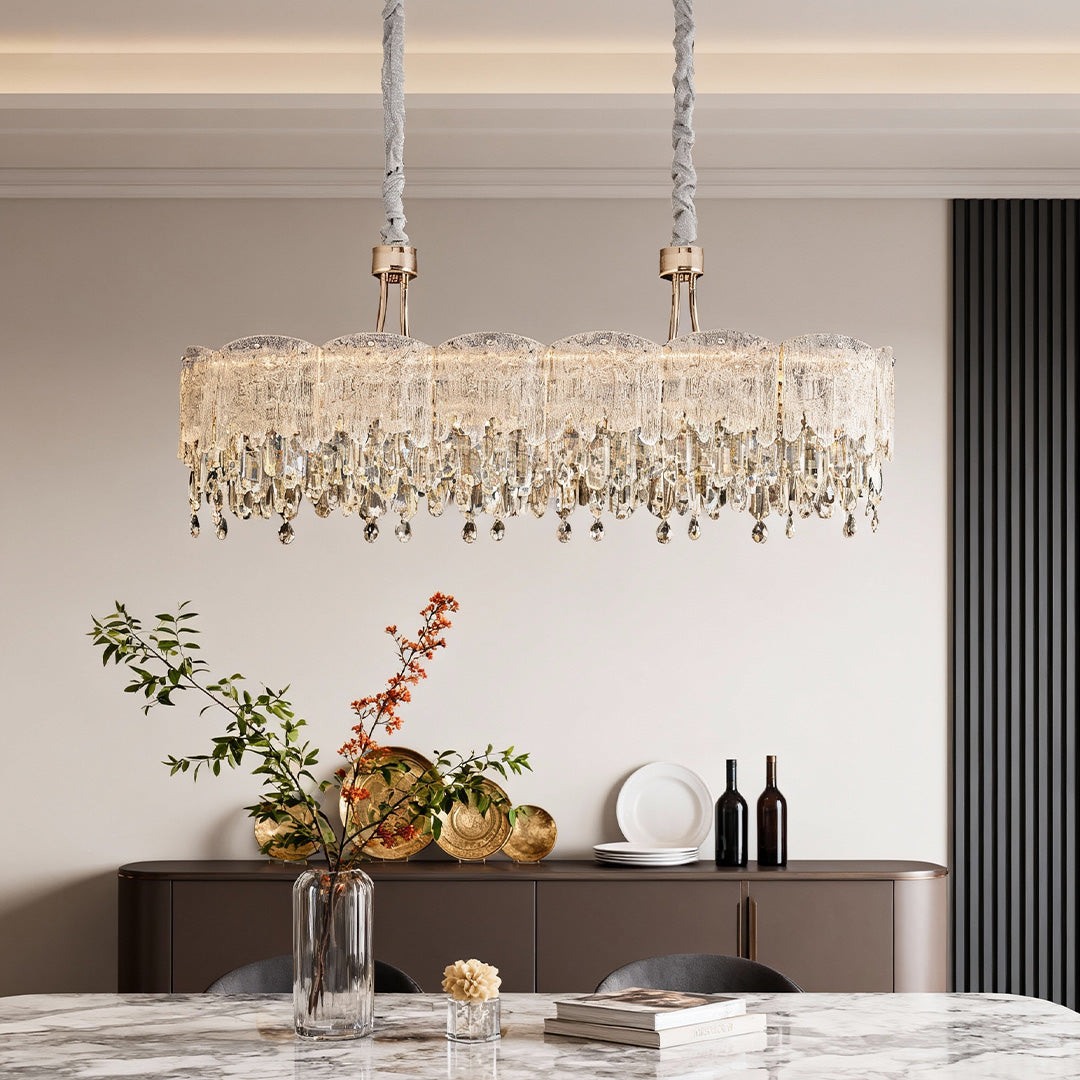 Close-up of glass fringe chandeliers showing detailed crystal strands and reflections.